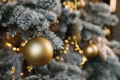 Photo of Beautiful decorated Christmas tree with baubles and lights as background, closeup