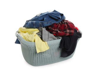 Photo of Plastic laundry basket full of clothes isolated on white