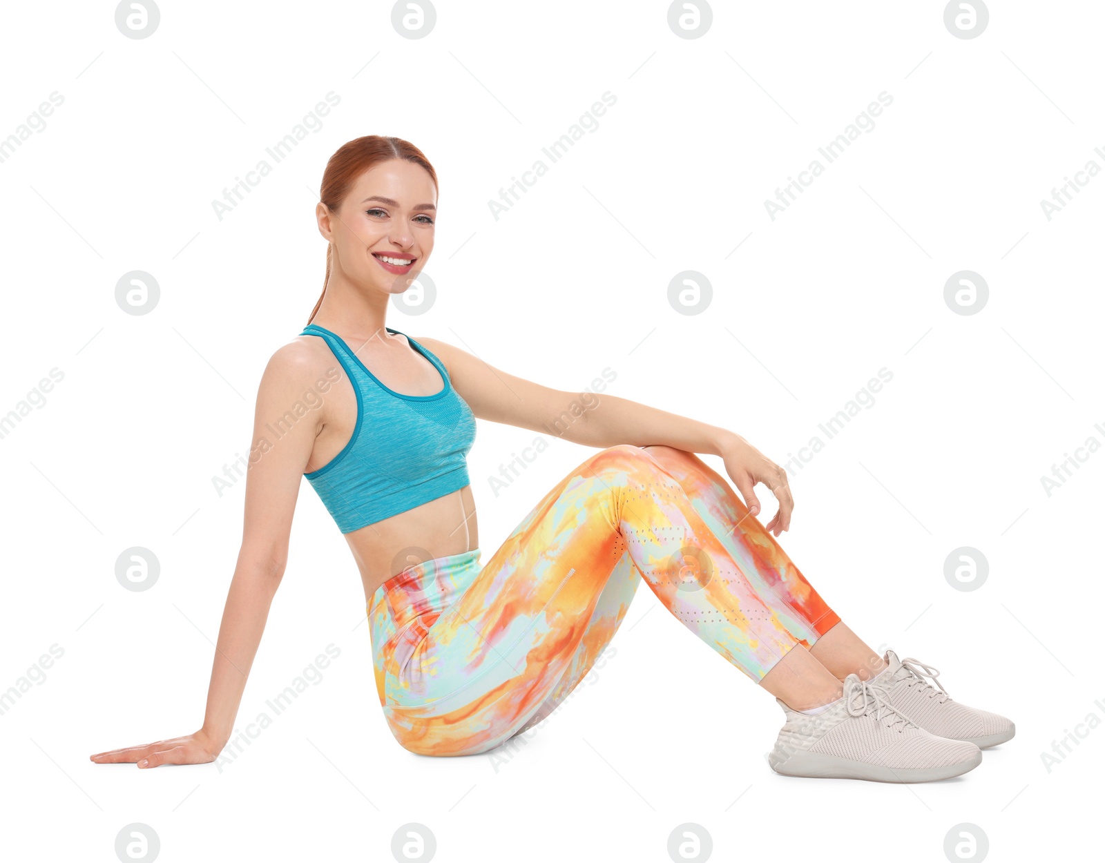 Photo of Young woman wearing sportswear on white background