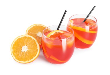 Photo of Aperol spritz cocktail, straws and orange slices in glasses isolated on white