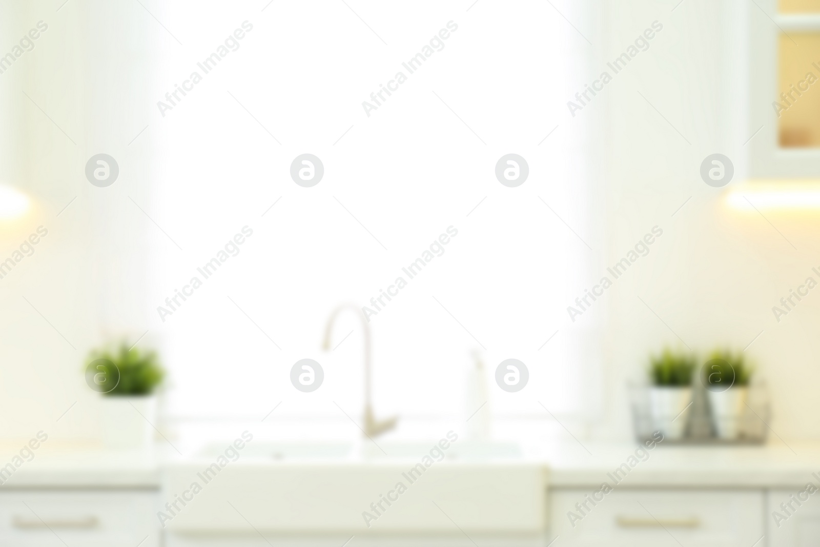 Photo of Blurred view of modern kitchen interior with stylish furniture