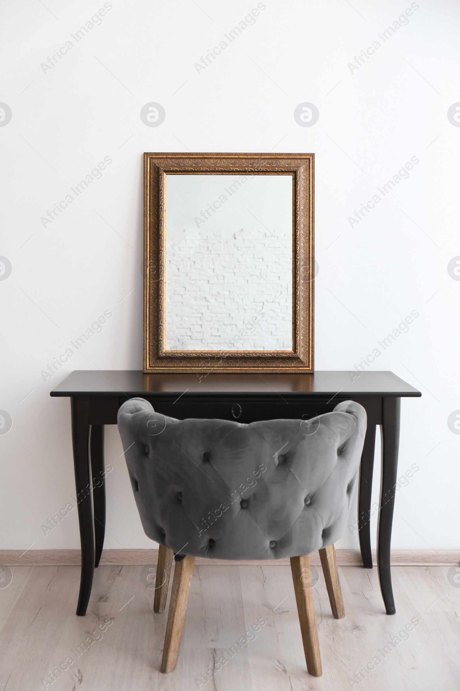 Photo of Modern makeup room interior with dressing table and mirror