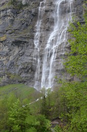 Photo of Picturesque view of beautiful waterfall in mountains