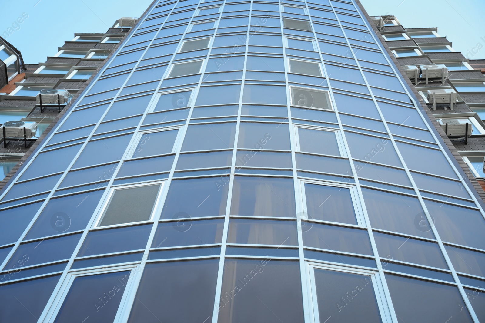 Photo of New modern building with tinted windows outdoors