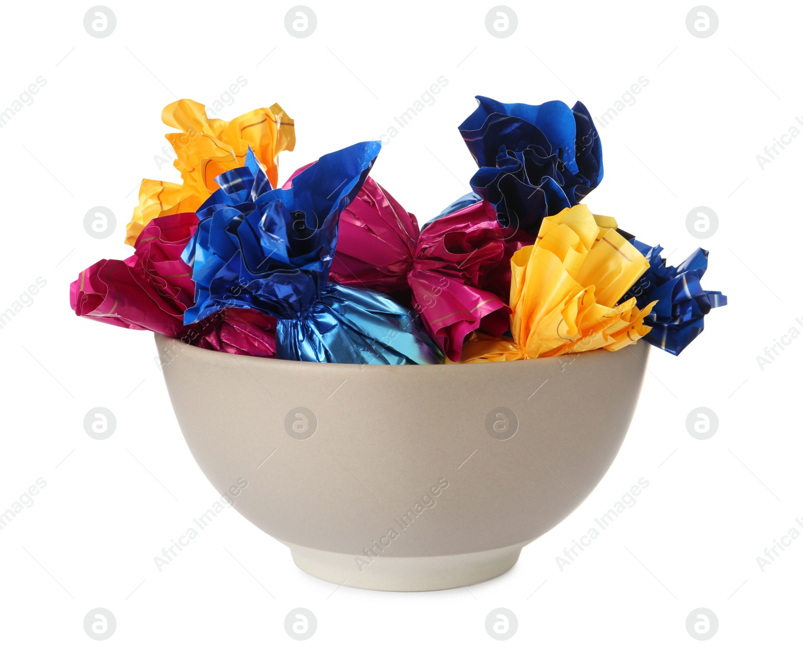 Photo of Bowl with candies in colorful wrappers isolated on white