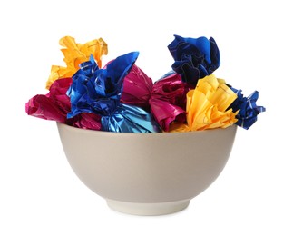 Bowl with candies in colorful wrappers isolated on white