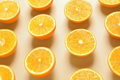 Composition with ripe oranges on color background