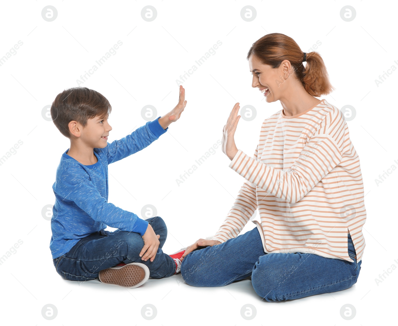 Photo of Hearing impaired mother and her child talking with help of sign language on white background