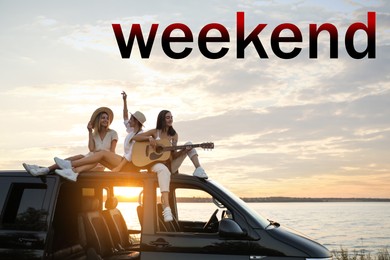 Image of Hello Weekend. Happy friends with guitar sitting on car roof outdoors at sunset