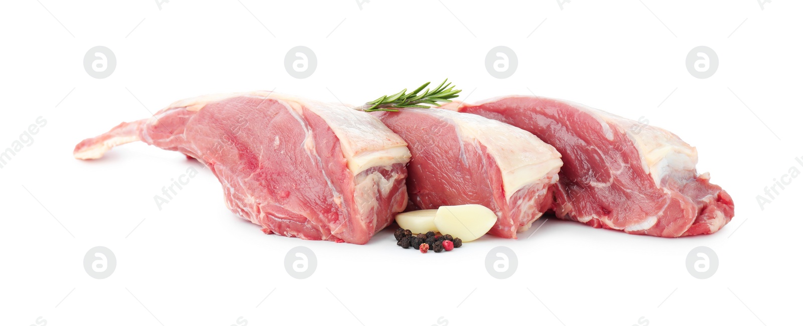 Photo of Pieces of raw beef meat and spices isolated on white