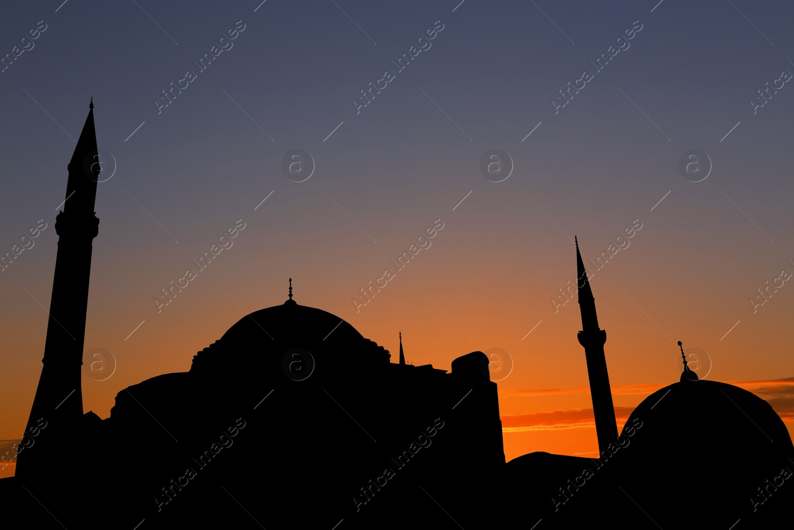 Image of Silhouette of mosque during sunset. Muslim culture