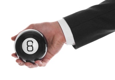 Photo of Man holding magic eight ball on white background, closeup