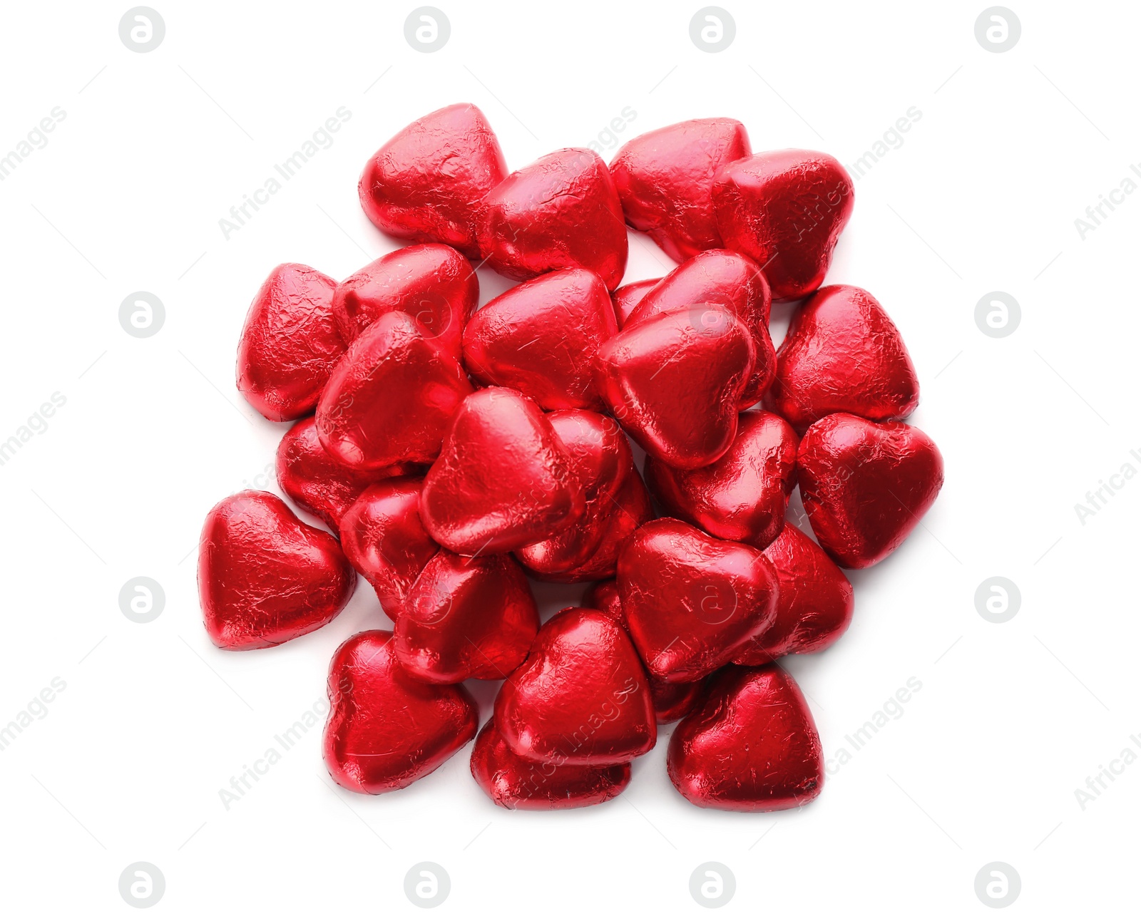 Photo of Heart shaped chocolate candies in red foil on white background, top view