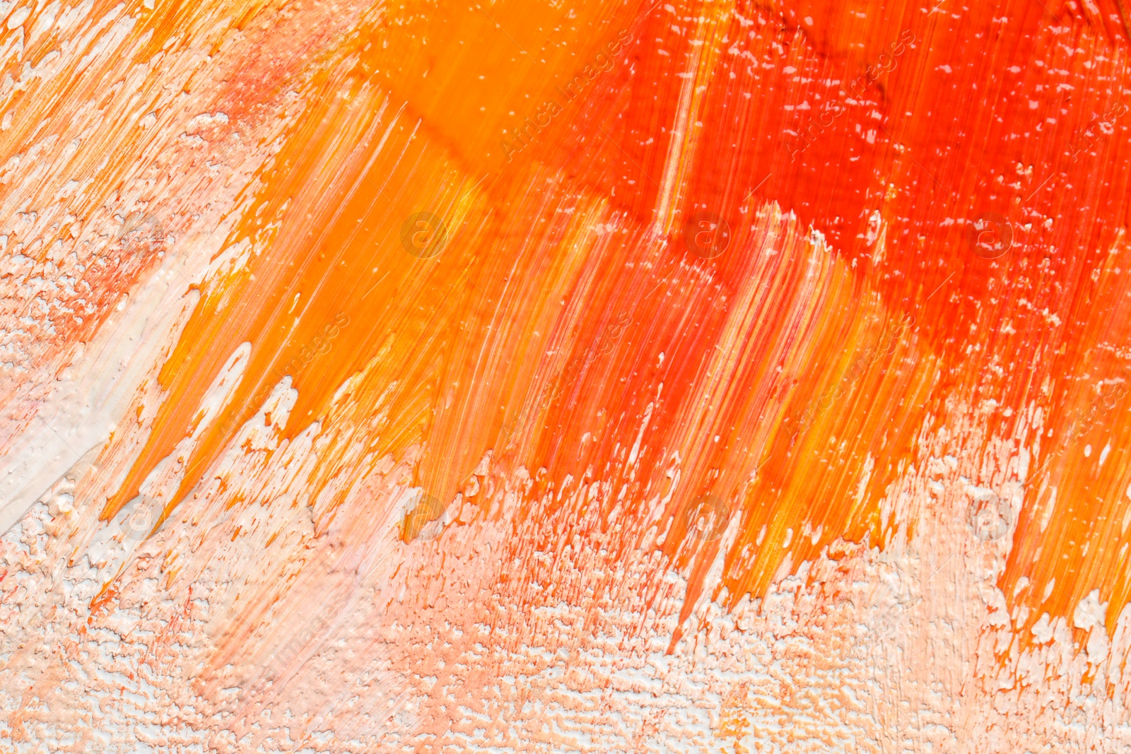 Photo of Beautiful strokes of colorful oil paints as background, closeup