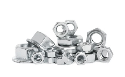 Photo of Many different metal nuts on white background