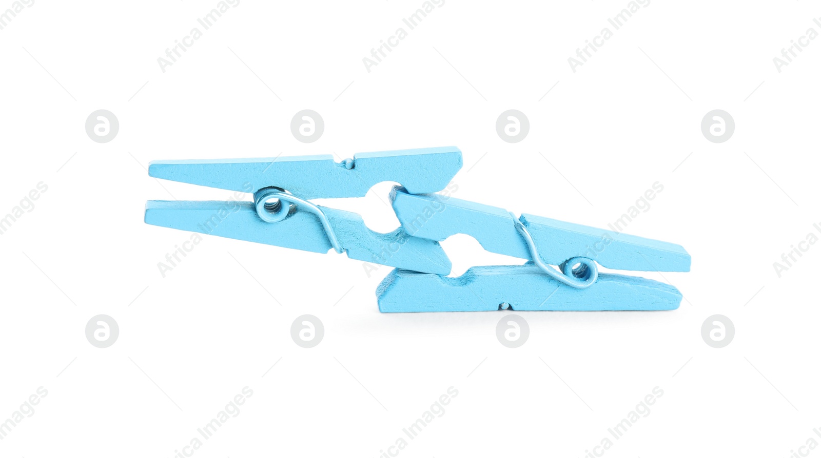 Photo of Two light blue wooden clothespins on white background