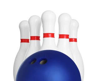 Image of Blue bowling ball and pins on white background