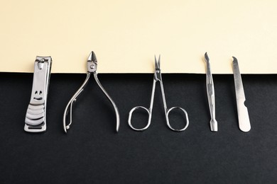 Photo of Set of manicure tools on color background