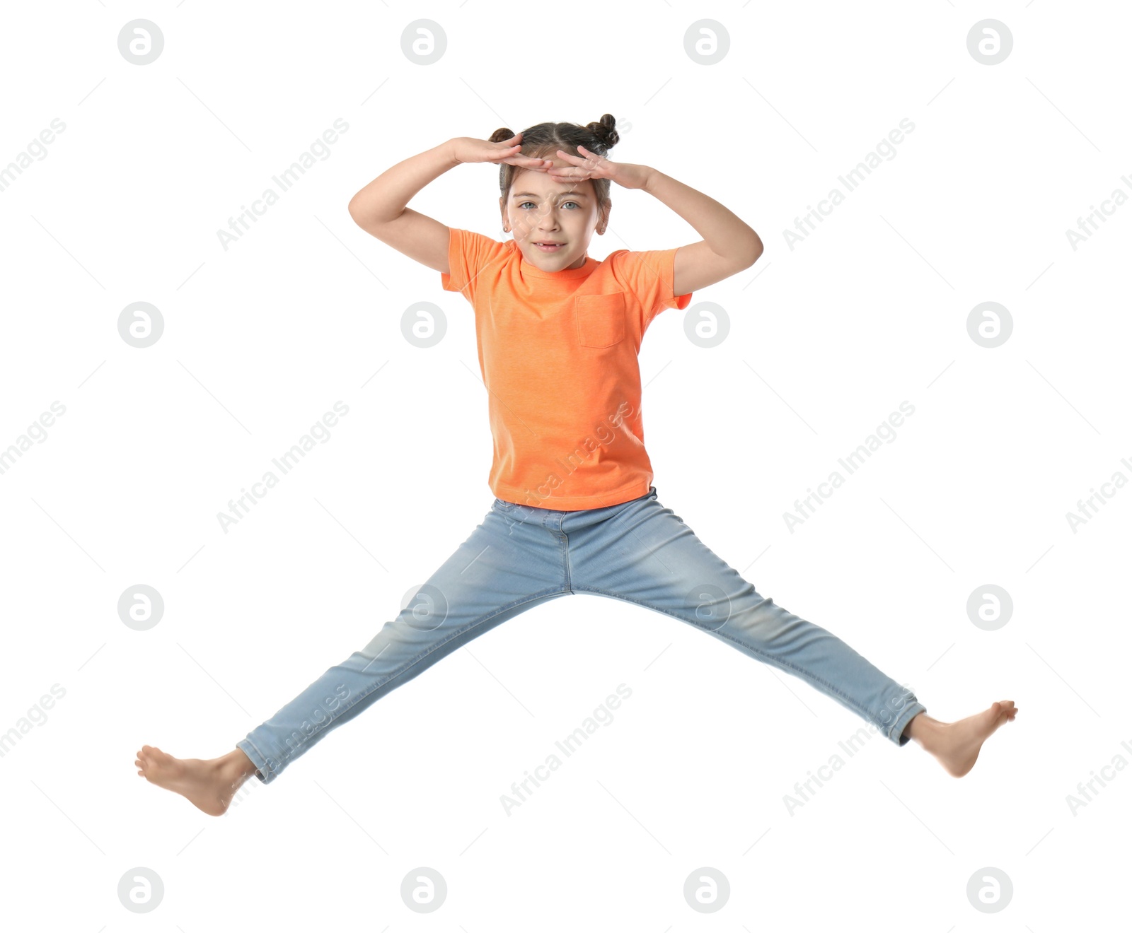 Photo of Cute little girl jumping on white background