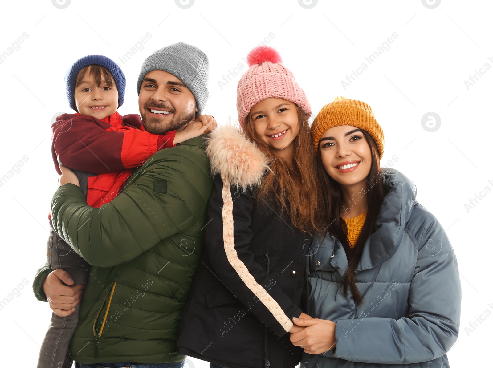 Photo of Happy family in warm clothes on white background. Winter vacation