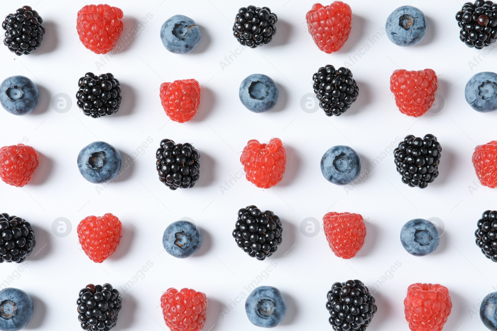 Photo of Composition with raspberries, blackberries and blueberries on white background