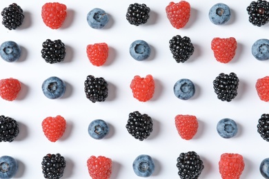 Photo of Composition with raspberries, blackberries and blueberries on white background