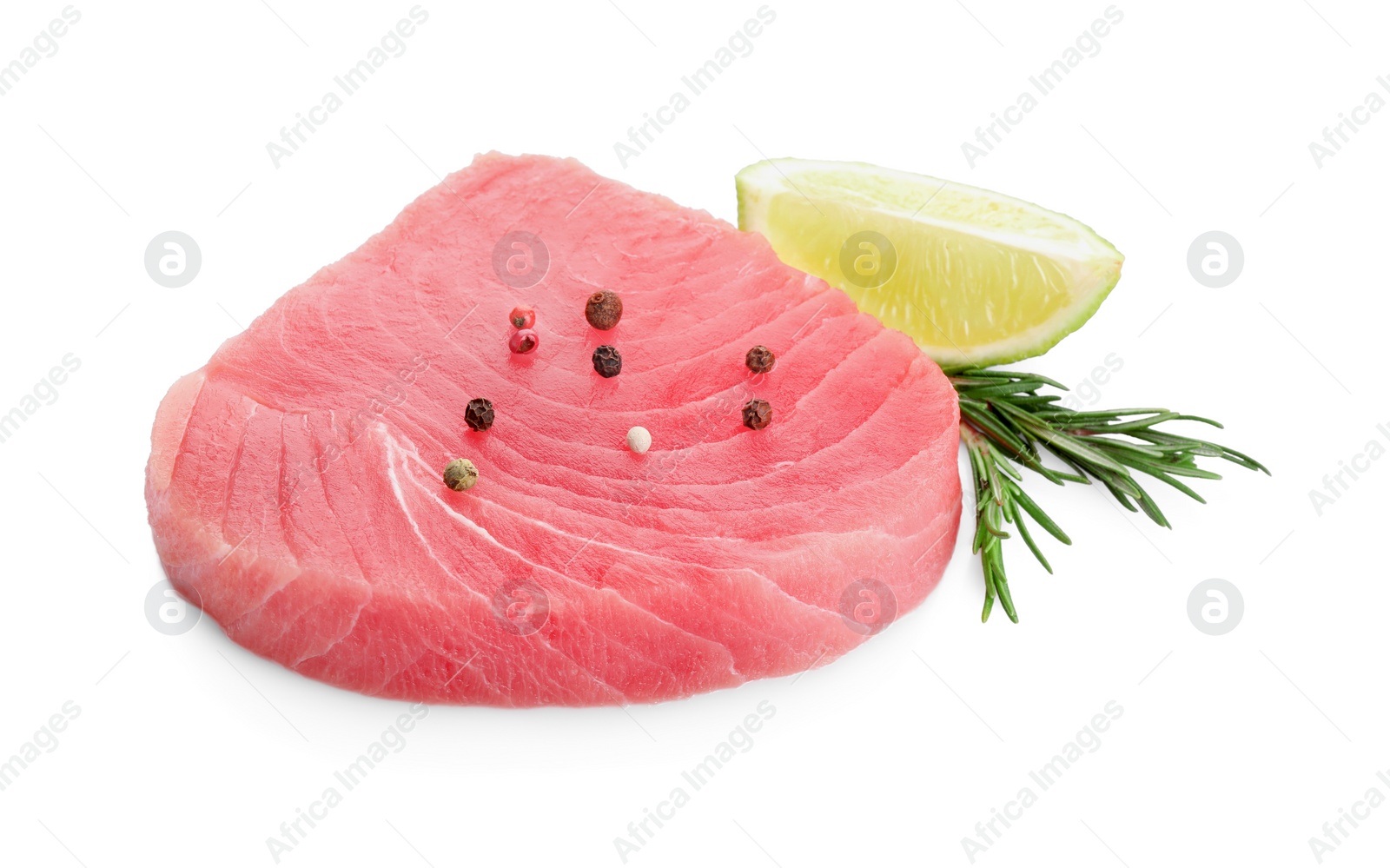 Photo of Raw tuna fillet with peppercorns, rosemary and lime wedge on white background