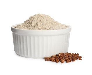 Photo of Bowl of buckwheat flour on white background
