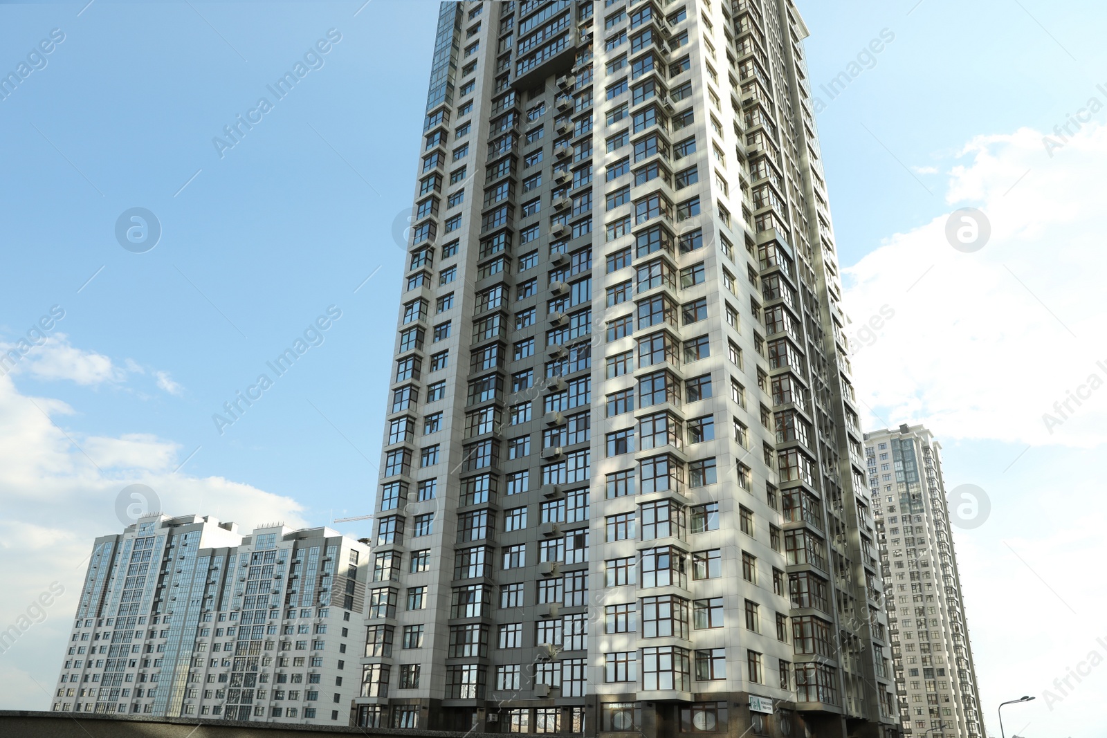 Photo of KYIV, UKRAINE - MAY 21, 2019: Beautiful view of modern housing estate in Pecherskyi district on sunny day, low angle