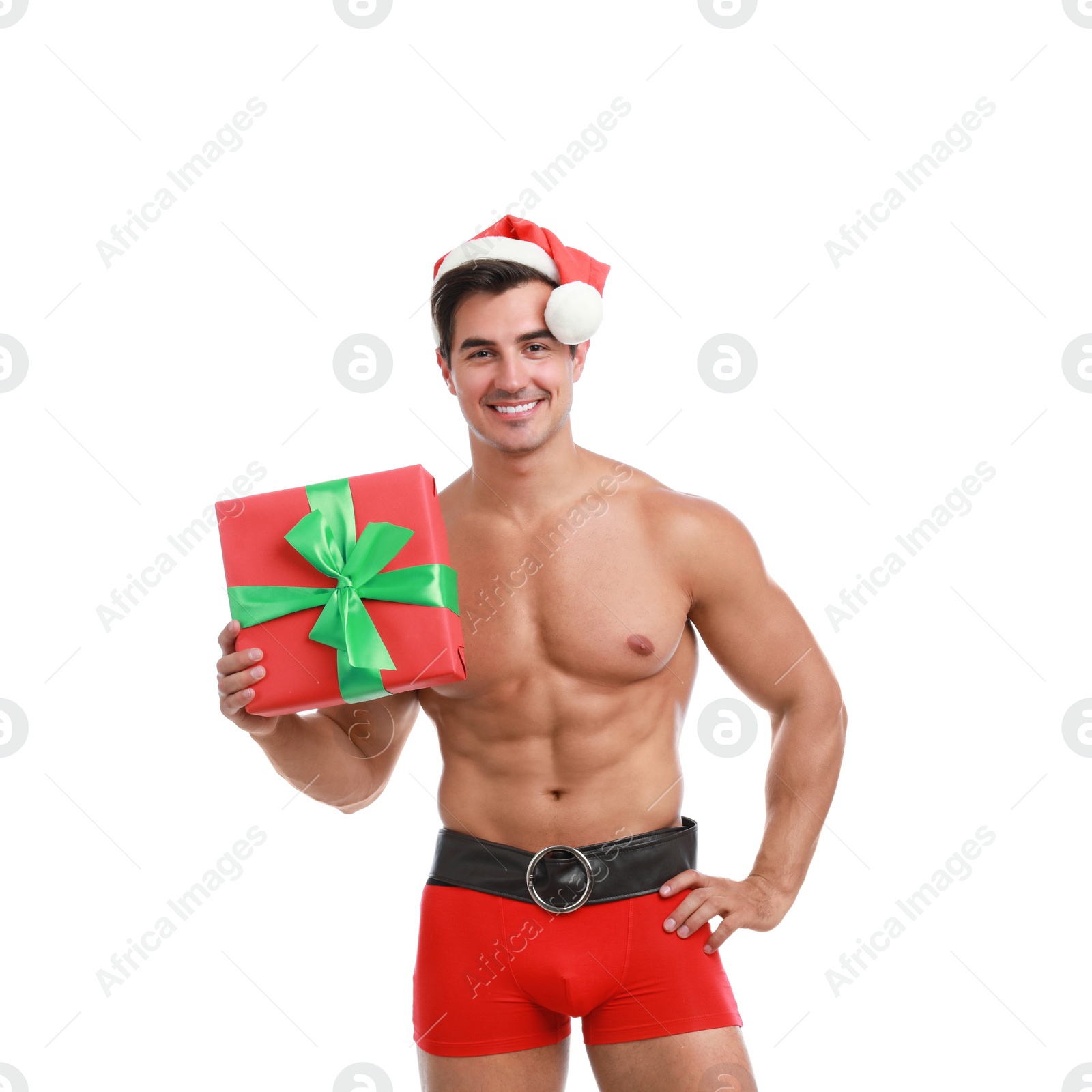 Photo of Sexy shirtless Santa Claus with gift on white background