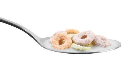 Cereal rings and milk in spoon isolated on white