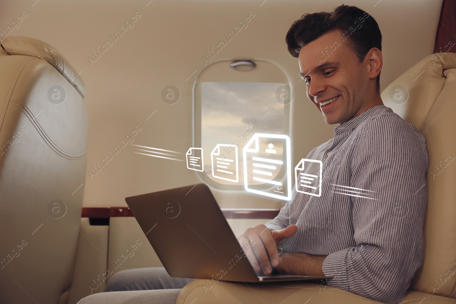 Image of Concept of electronic signature. Man using laptop in airplane during flight
