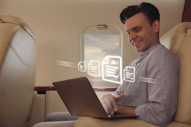 Image of Concept of electronic signature. Man using laptop in airplane during flight