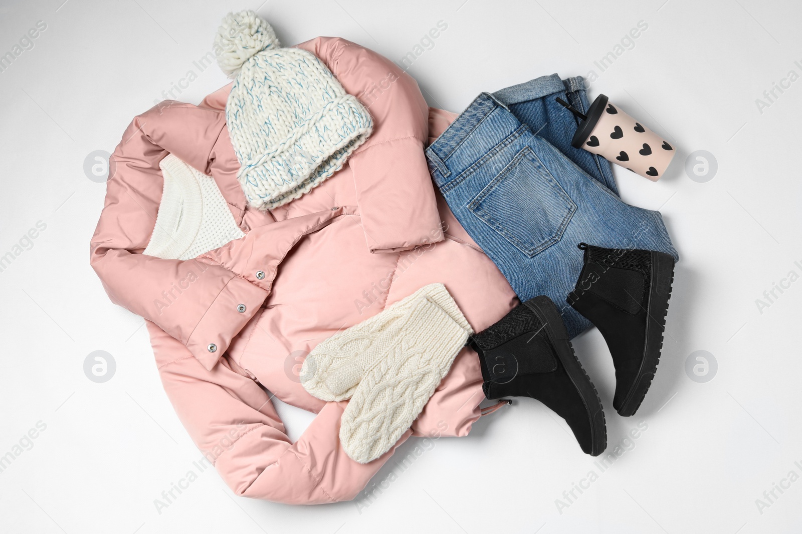 Photo of Set of stylish winter clothes on white background, top view