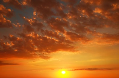 Image of Beautiful view of orange sky with clouds at sunset