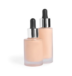 Bottles of skin foundation on white background. Makeup product