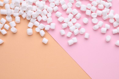Delicious marshmallows on color background, flat lay. Space for text