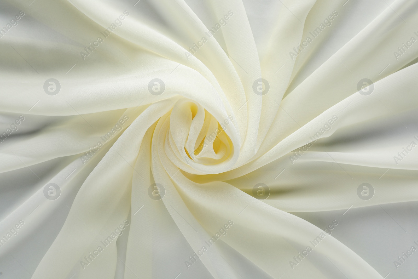 Photo of Beautiful white tulle fabric as background, top view