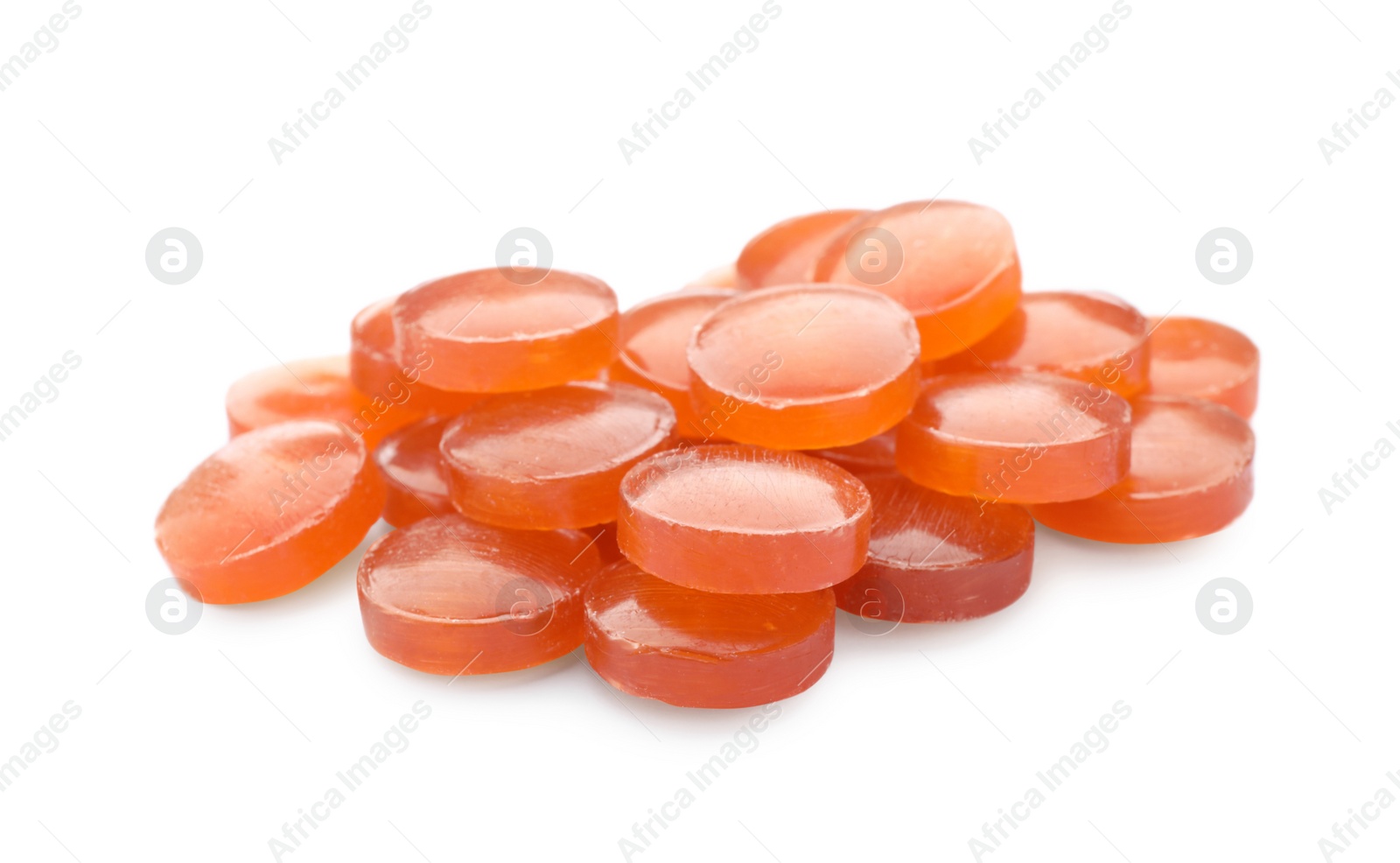 Photo of Many orange cough drops on white background