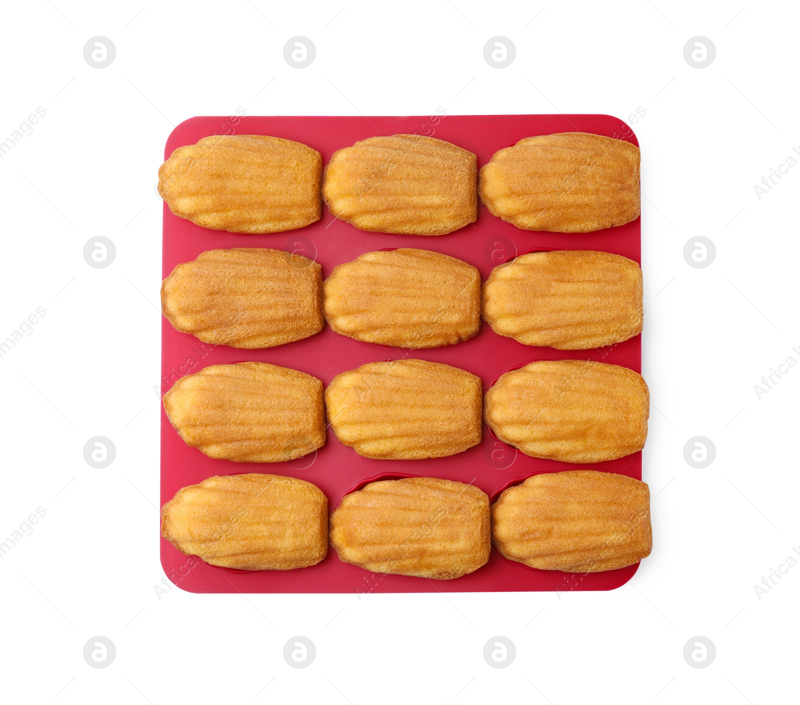 Photo of Tasty madeleine cookies in baking mold isolated on white, top view