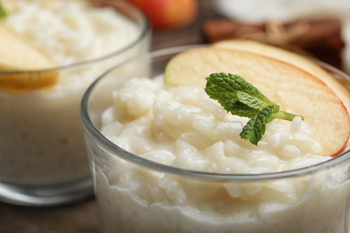 Delicious rice pudding with apple and mint, closeup