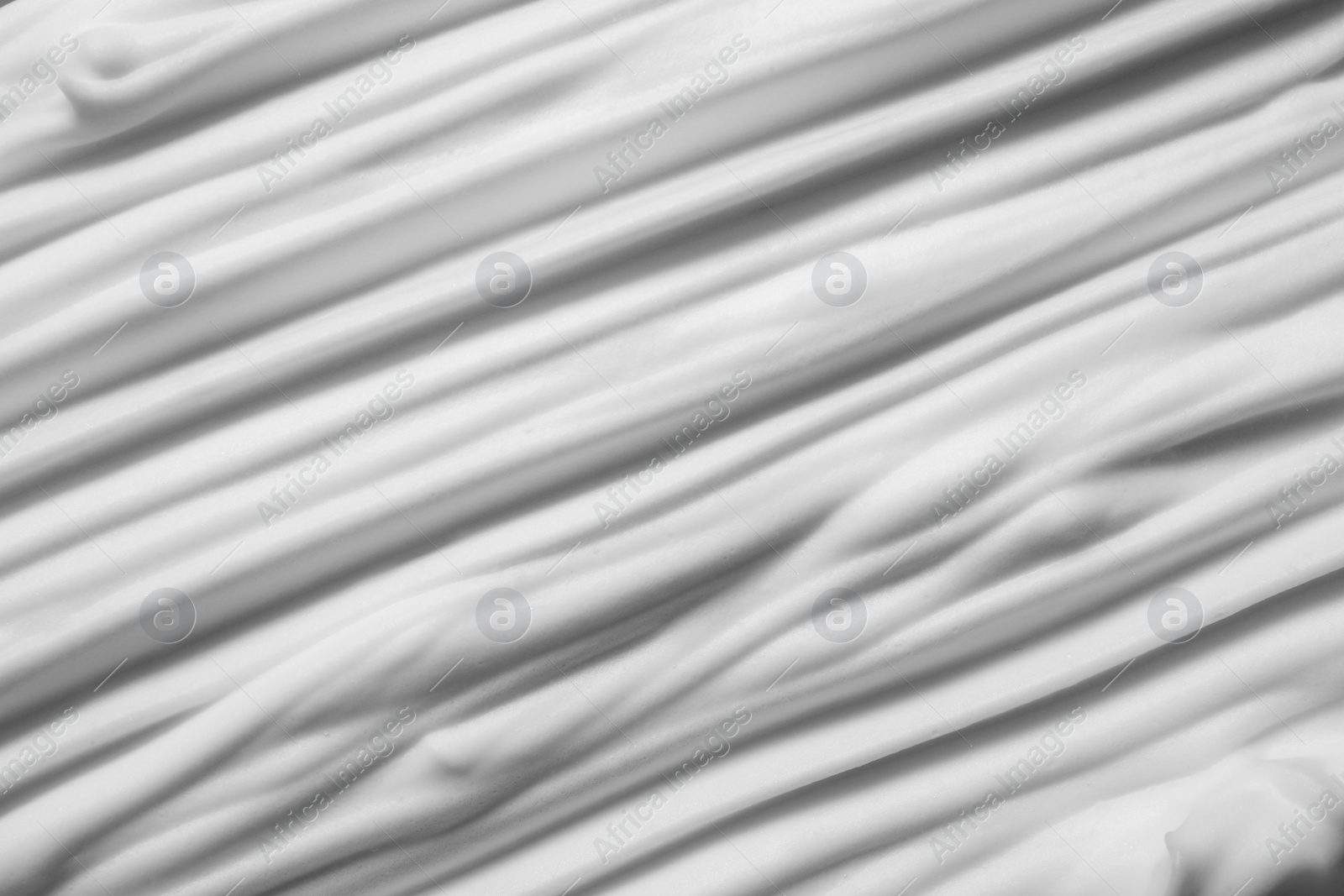 Photo of Texture of white shaving foam as background, top view