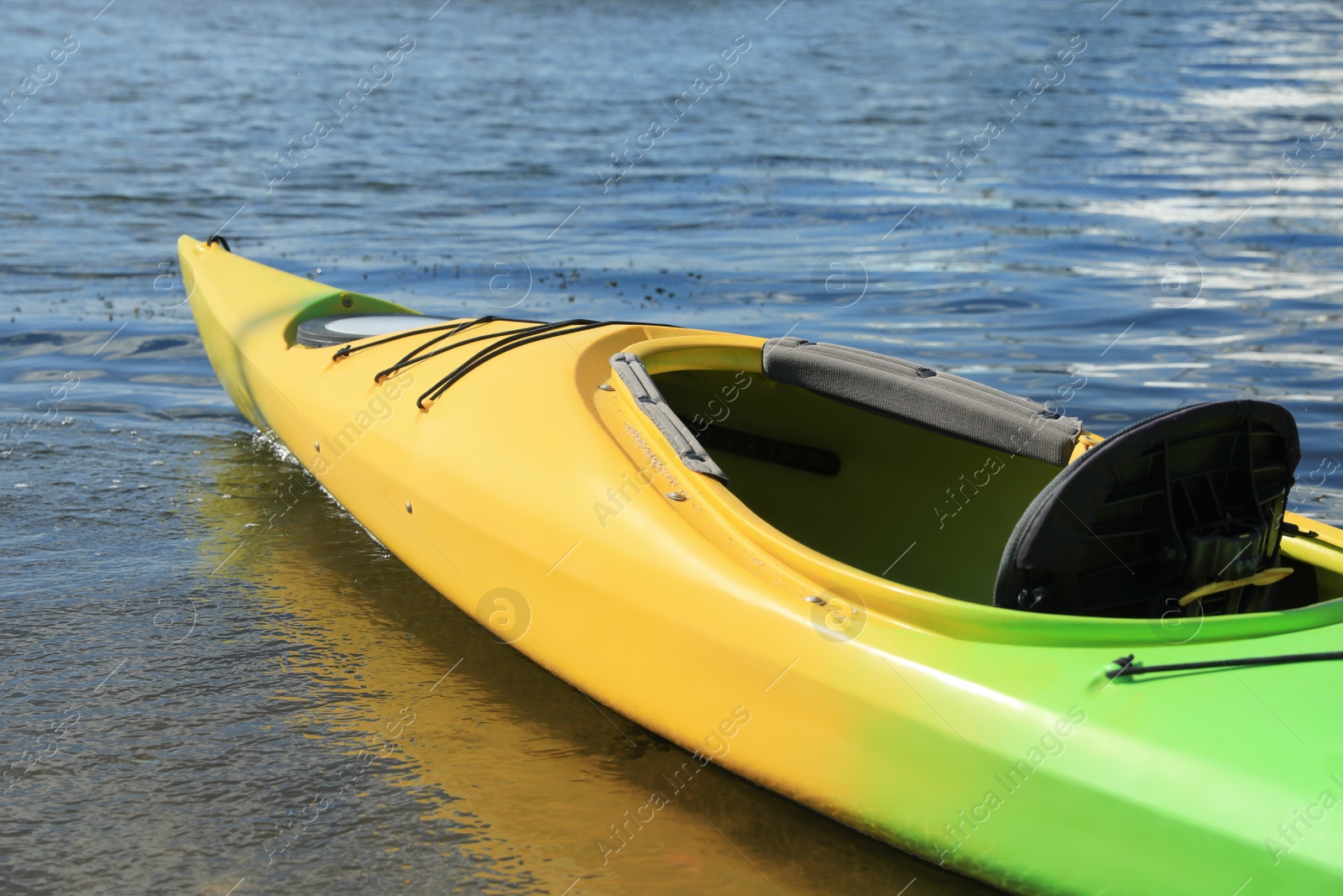 Photo of Modern kayak on river, closeup. Summer camp activity