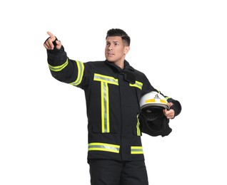Photo of Portrait of firefighter in uniform with helmet on white background