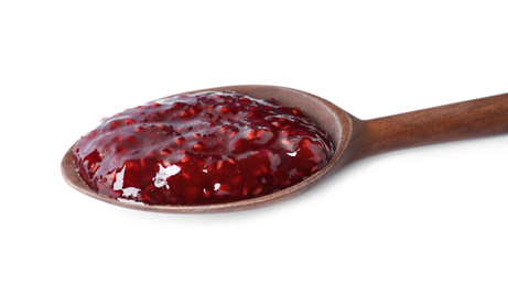 Photo of Delicious raspberry jam in wooden spoon isolated on white