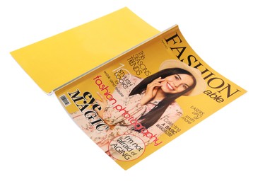 Photo of Modern printed fashion magazine isolated on white