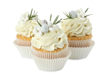 Photo of Tasty Easter cupcakes with vanilla cream isolated on white