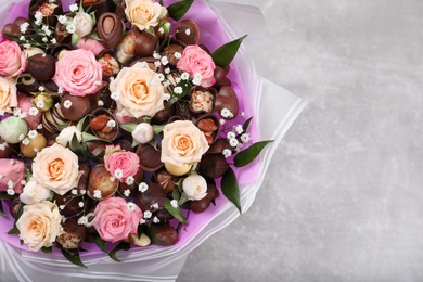 Beautiful food bouquet on light grey table, top view. Space for text