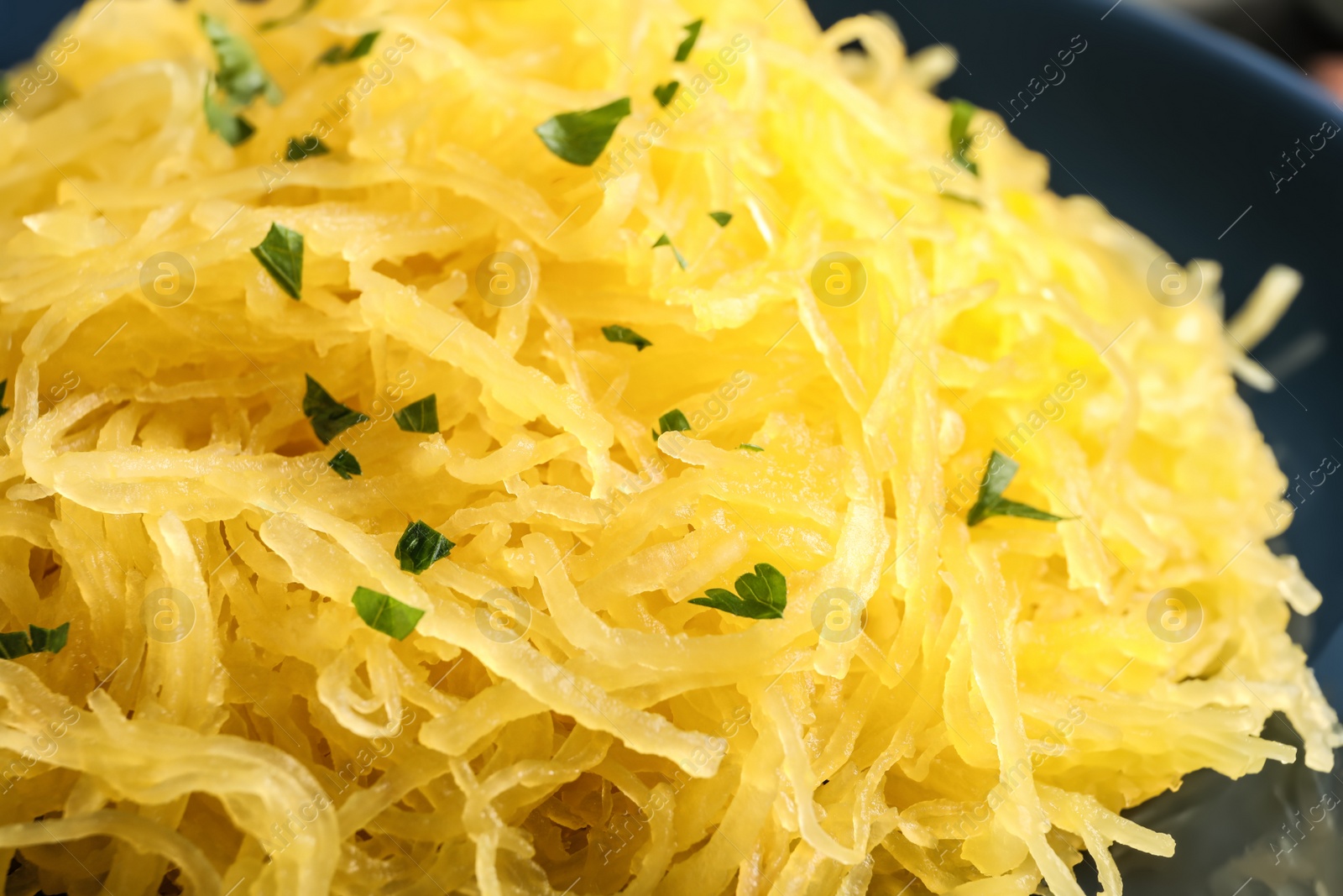 Photo of Cooked spaghetti squash on plate, closeup
