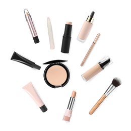 Face powder, concealers, liquid foundations and brush isolated on white. Collection of makeup products